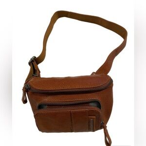Spikes & Sparrow brown leather belt bag can be worn across chest too. O